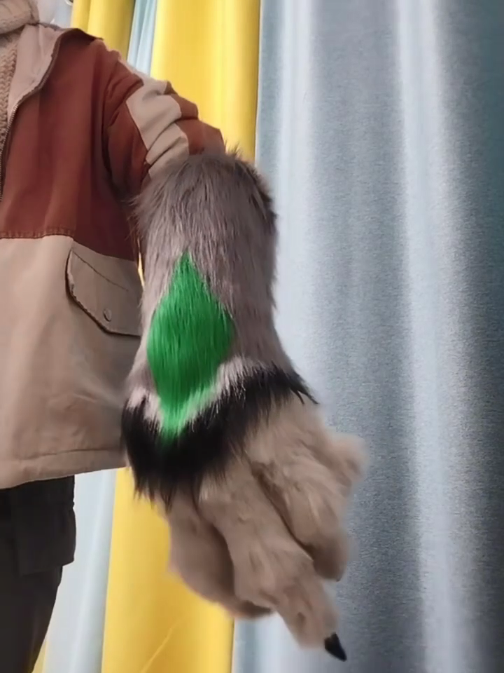 Giant claws, furry fursuit, with long black fur, green paw pads, long claws, and half-sleeve design. Can be customized in different colors.